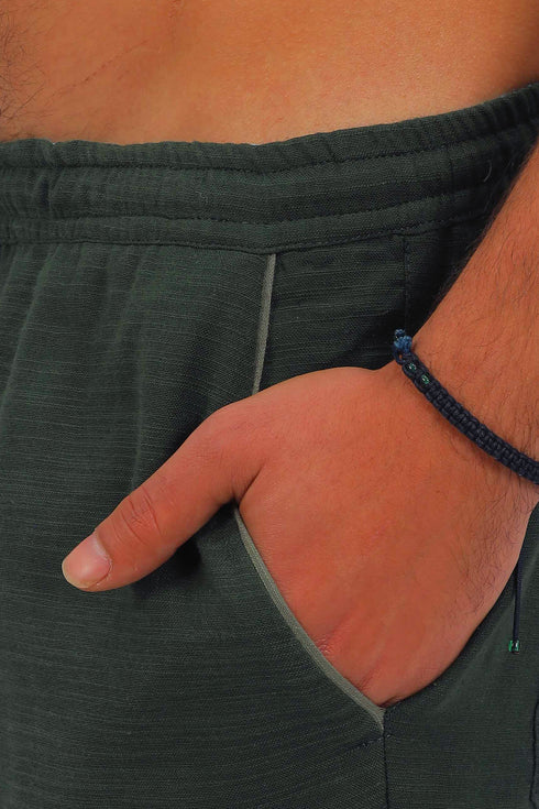 Straight leg cotton pants with elastic waistline and pockets